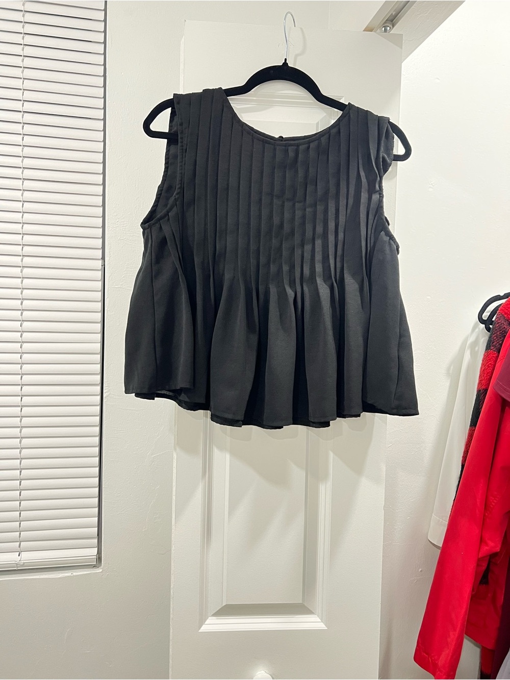 Sleeveless Black Pleated Peplum Top